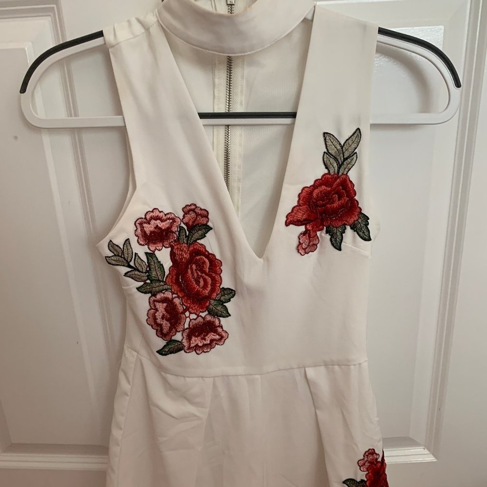 White romper with embroidered roses